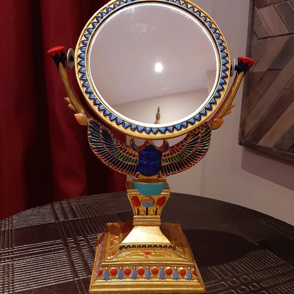 Very cool well made wood mirror. Hand carved and painted.